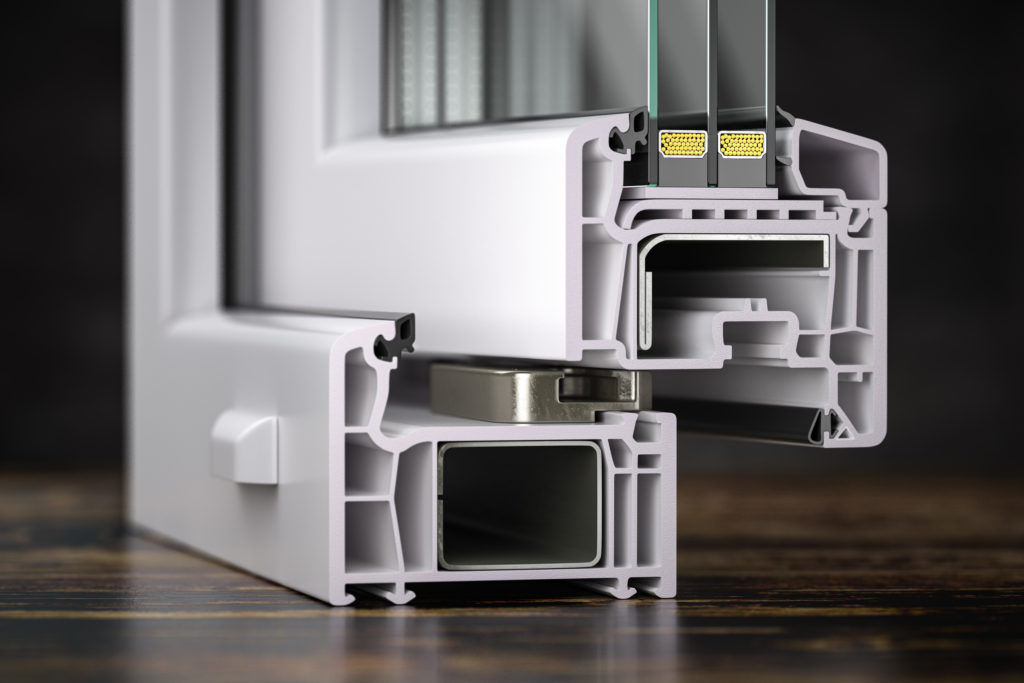 Cross section of plastic window profile PVC slose up on the table. profilehellas_company
